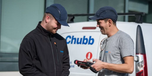 Two professionals discussing how to protect companies