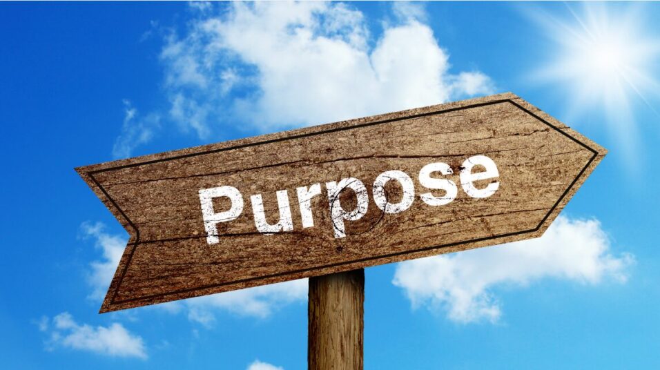 Sign in the clouds with the word purpose written on it